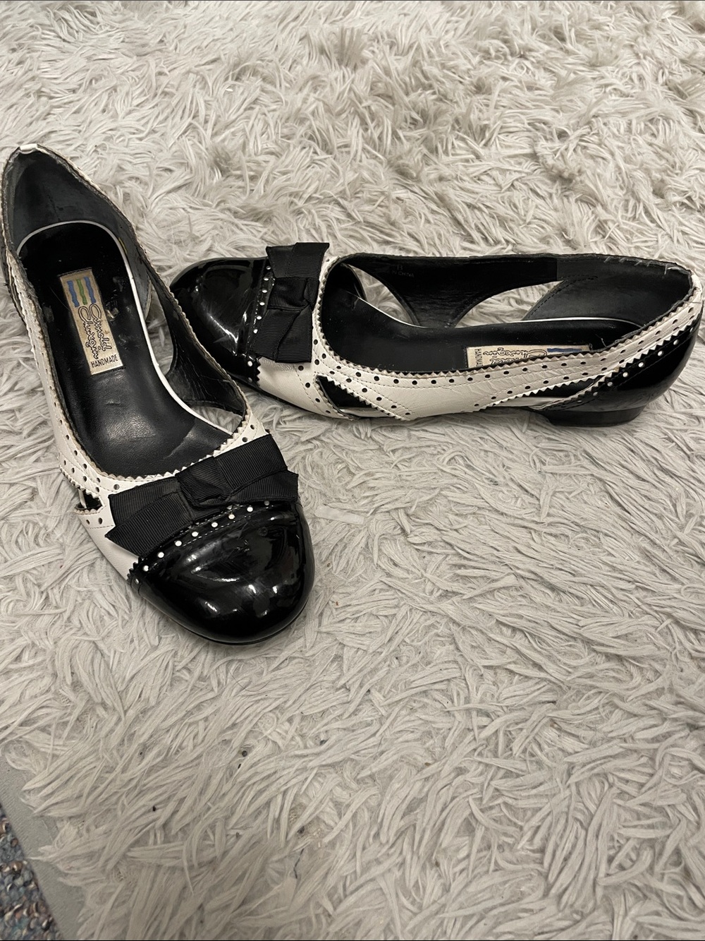 Handmade leather Black and White Bow-Accent Flats by Arnold churgin